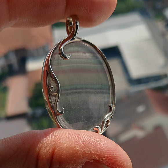 Oval shaped Sterling Silver Artwork Pendant with multicolor Fluorite